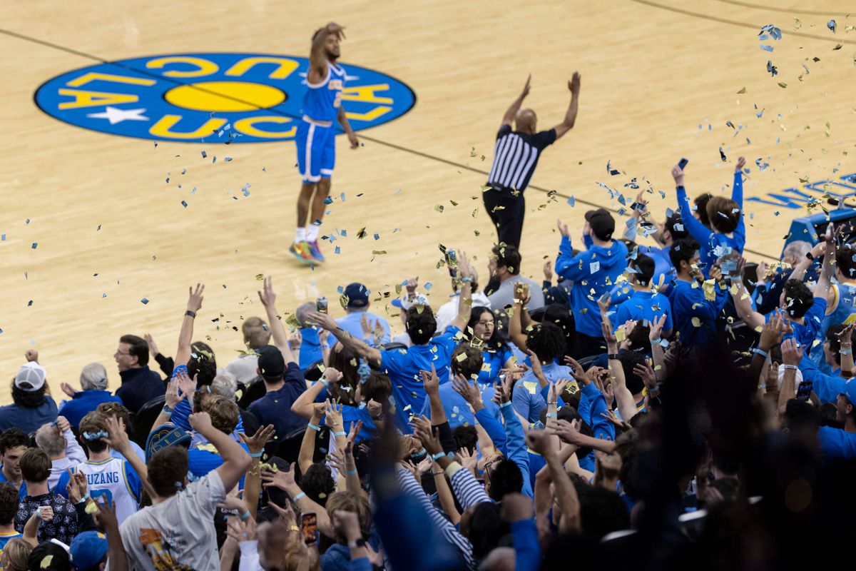 UCLA fans throw confetti in the air to celebrate the first made basket of the game by the UCLA Bruins during an NCAA basketball game against the USC Trojans, Tuesday February 24, 2026 in Los Angeles, Calif.