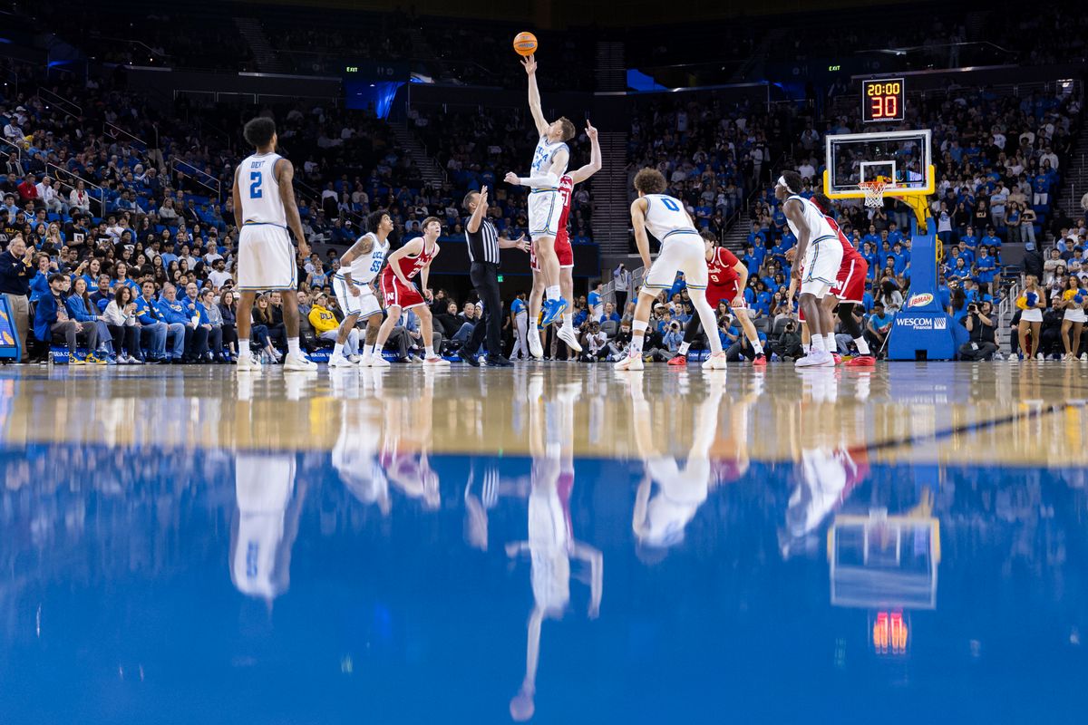 Tyler Bilodeau #34 of the UCLA Bruins and Rienk Mast #51 of the Nebraska Cornhuskers jump for the opening tip-off during an NCAA basketball game, Tuesday March 3, 2026 in Los Angeles, Calif.