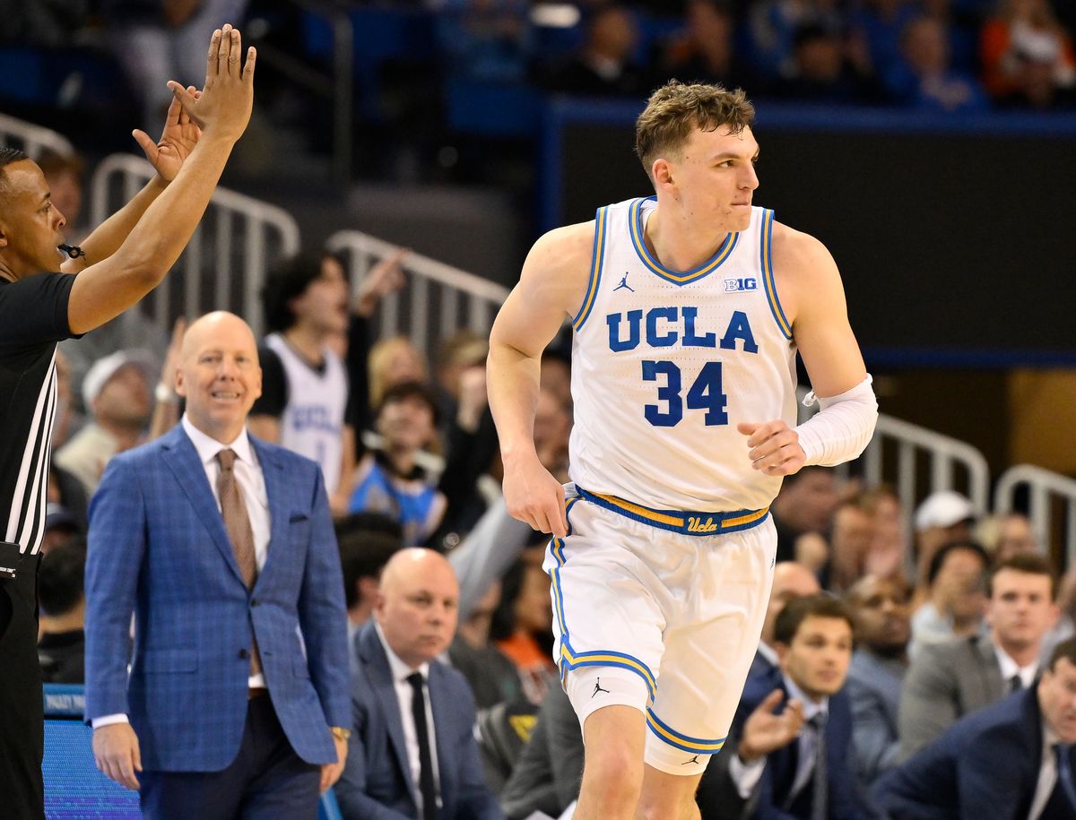 UCLA forward Tyler Bilodeau (34) runs back on defense after scoring a three-point basket during the second half against the Illinois Fighting Illini at Pauley Pavilion presented by Wescom Financial. 