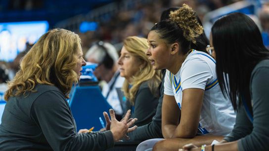 UCLA Bruins Coach Cori Close breaking down the game for Avary Cain (2) during an NCAA basketball game against Colgate, Sunday November 10th, 2024 in Los Angeles, California. 