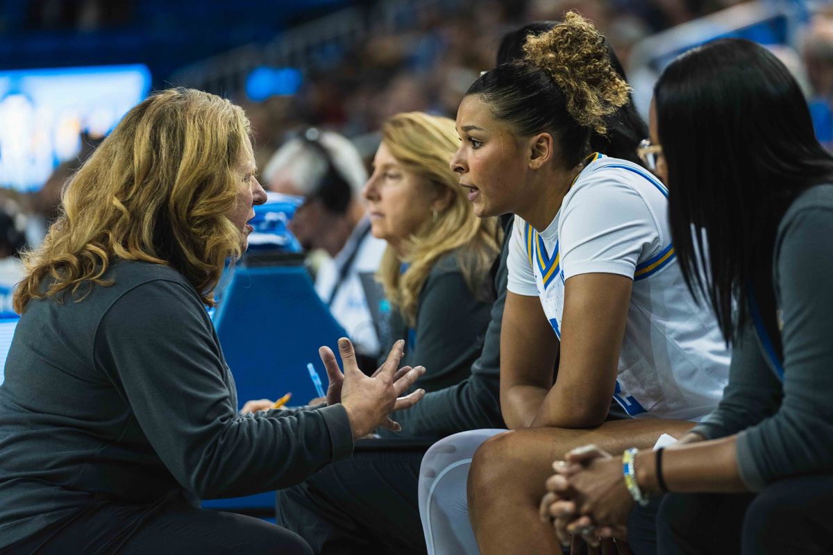UCLA Bruins Coach Cori Close breaking down the game for Avary Cain (2) during an NCAA basketball game against Colgate, Sunday November 10th, 2024 in Los Angeles, California. 