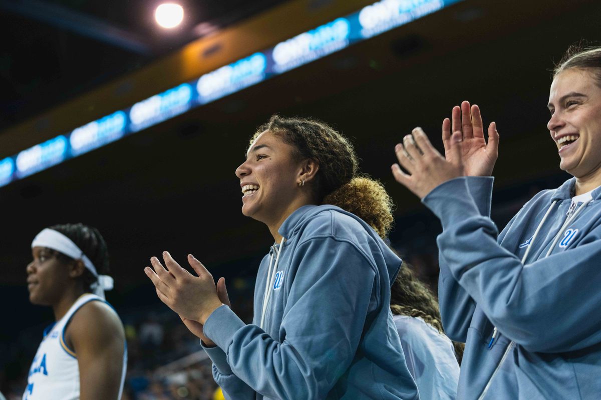 UCLA Bruins Guard Kiki Rice (1) cheering on the team from the sidelines during an NCAA basketball game against Colgate, Sunday November 10th, 2024 in Los Angeles, California. UCLA Bruins Guard Kiki Rice (1) cheering on the team from the sidelines during an NCAA basketball game against Colgate, Sunday November 10th, 2024 in Los Angeles, California.
