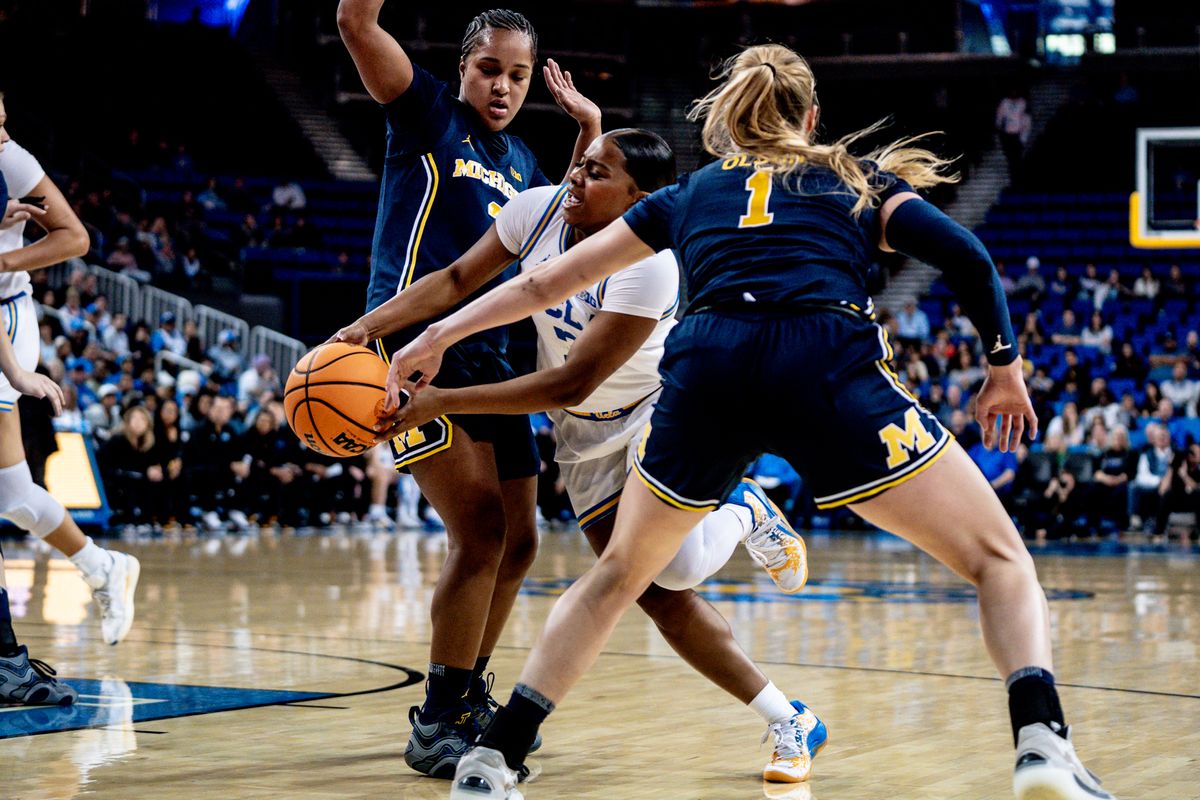 UCLA G London Jones (3) attacking two defenders during an NCAA basketball game against the South Carolina Gamecocks, Wednesday January 1st, 2025 in Los Angeles, California. 