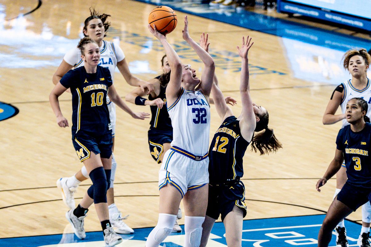UCLA F Angela Dugalic (32) makes a layup during an NCAA basketball game against the Michigan Wolverans, Wednesday January 1st, 2025 in Los Angeles, California. 