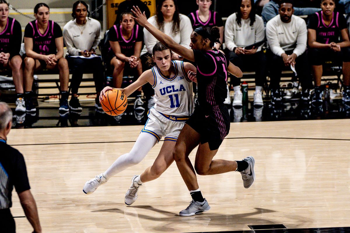 UCLA G Gabiela Jaquez (11) attacks the defender in a game against Penn State, Wednesday January 15, 2025 in Long Beach, Calif.