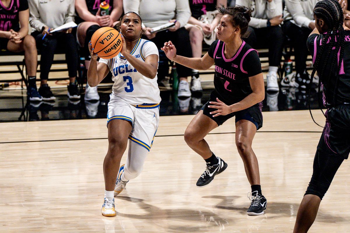 UCLA G Londynn Jones (3) drives to the basket in a game against Penn State, Wednesday January 15, 2025 in Long Beach, Calif.
