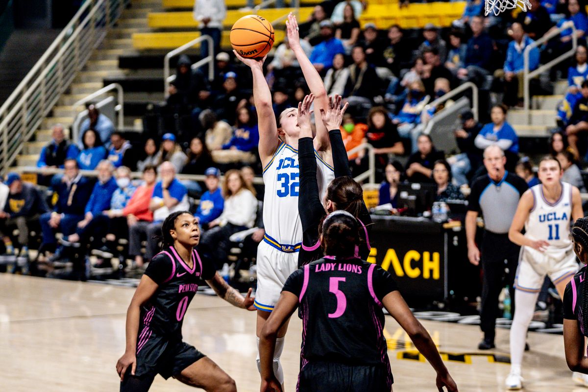 UCLA F Angela Dugalic (32) takes it in on two defender's in a game against Penn State, Wednesday January 15, 2025 in Long Beach, Calif.