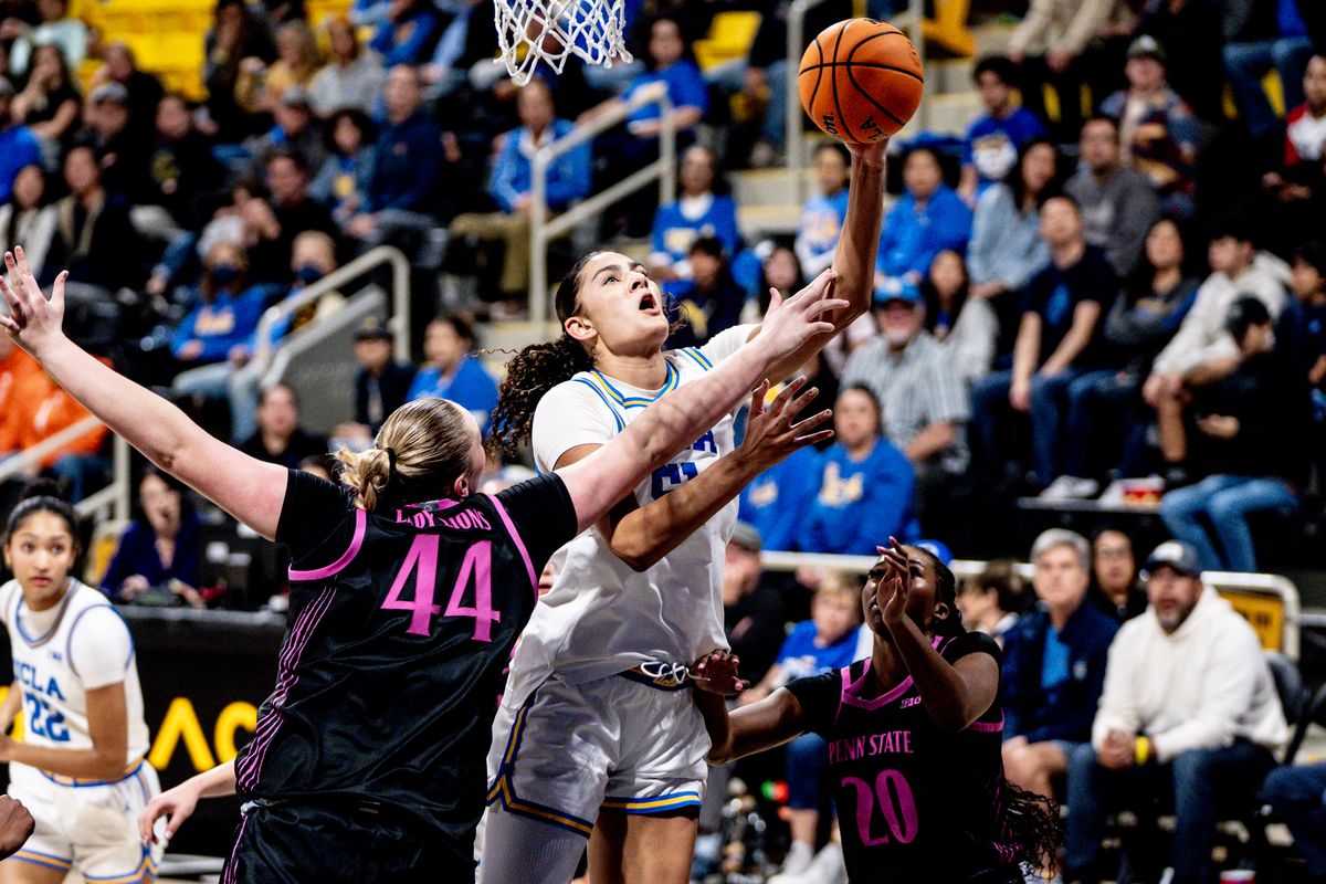 UCLA C Lauren Betts (51) drives in for two points in a game against Penn State, Wednesday January 15, 2025 in Long Beach, Calif.