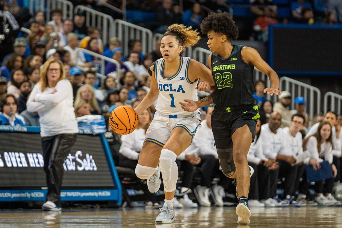 UCLA guard Kiki Rice (1) drives to the basket in a game against Michigan State, Sunday February 16, 2025 in Los Angeles, Calif. UCLA guard Kiki Rice (1) drives to the basket in a game against Michigan State, Sunday February 16, 2025 in Los Angeles, Calif.