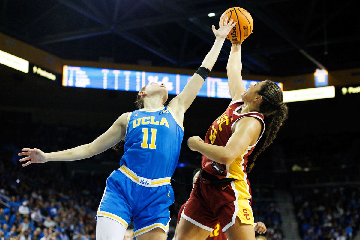 Gabriela Jaquez #11 of the UCLA Bruins and Talia von Oelhoffen #55 of the USC Trojans rebound the ball during the first half at Pauley Pavilion on March 1, 2025 in Los Angeles, California. Gabriela Jaquez #11 of the UCLA Bruins and Talia von Oelhoffen #55 of the USC Trojans rebound the ball during the first half at Pauley Pavilion on March 1, 2025 in Los Angeles, California.