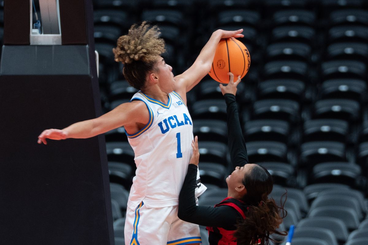 UCLA guard Kiki Rice (1) blocking a shot during a Big 10 basketball game against SDSU, Monday, November 3rd, 2025 in Anaheim, California
