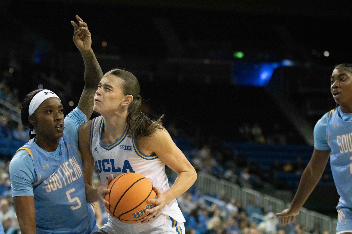 UCLA guard Gabriela Jaquez (11) drives to the basket while defended by Southern guard D'Shauntae Edwards (5) during a NCAA basketball game between UCLA and Southern University on Sunday, November 23, 2025 at Pauley Pavilion in Los Angeles, CA. 
