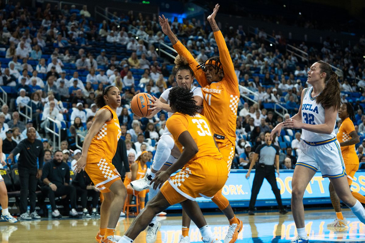 UCLA Bruins guard KiKi Rice (1) drives on three defenders and kicks it out to the shooter during an NCAA basketball game against the Tennessee Lady Volunteers on Sunday, November 30, 2025 at Pauley Pavilion in Los Angeles, Calif.