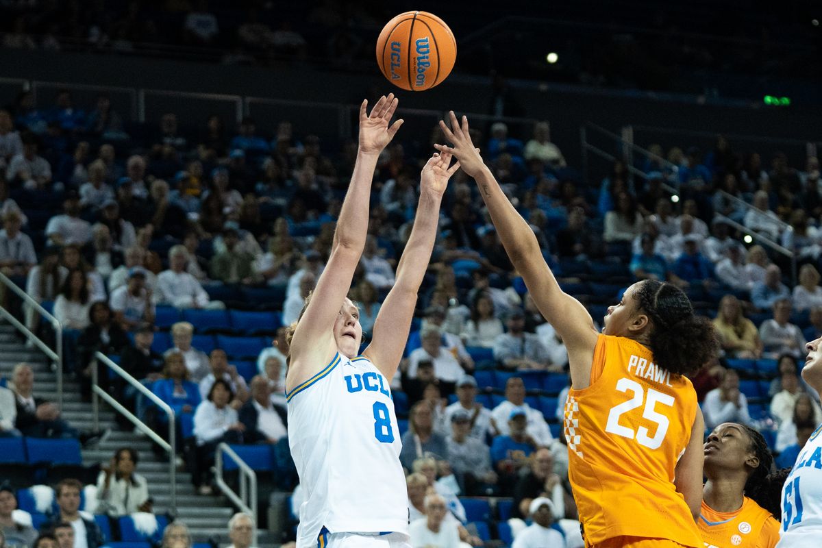 UCLA Bruins guard Gianna Kneepkens (8) shoots a tough shot over her defender during an NCAA basketball game against the Tennessee Lady Volunteers on Sunday, November 30, 2025 at Pauley Pavilion in Los Angeles, Calif.