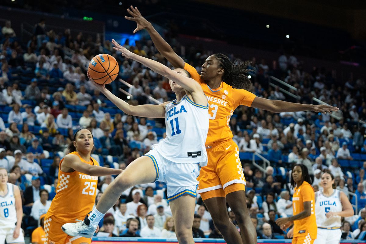 UCLA Bruins guard Gabriela Jaquez (11) drives to the basket and gets hit over her head for a foul during an NCAA basketball game against the Tennessee Lady Volunteers on Sunday, November 30, 2025 at Pauley Pavilion in Los Angeles, Calif.