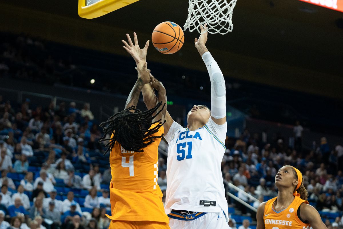 UCLA Bruins center Lauren Betts (51) goes up on the defender and gets slapped in the arm during an NCAA basketball game against the Tennessee Lady Volunteers on Sunday, November 30, 2025 at Pauley Pavilion in Los Angeles, Calif.