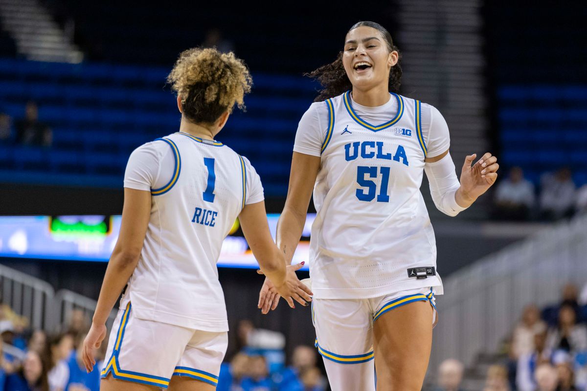 Center Lauren Betts #51 high fives guard Kiki Rice #1 of the UCLA Bruins during an NCAA basketball game against the Oregon Ducks, Sunday December 7, 2025 in Los Angeles, Calif.