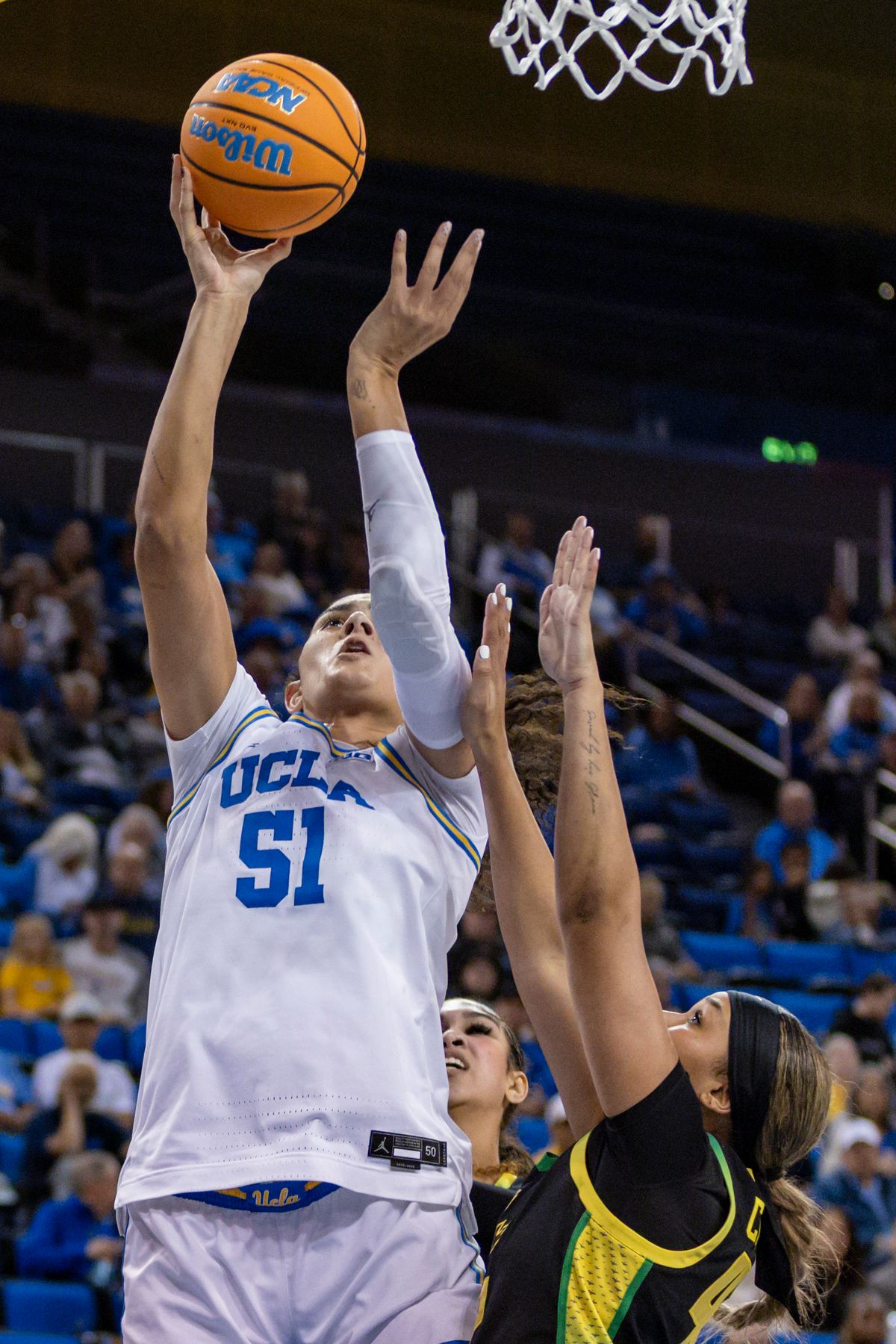 Center Lauren Betts #51 of the UCLA Bruins lays the ball up during an NCAA basketball game against the Oregon Ducks, Sunday December 7, 2025 in Los Angeles, Calif.