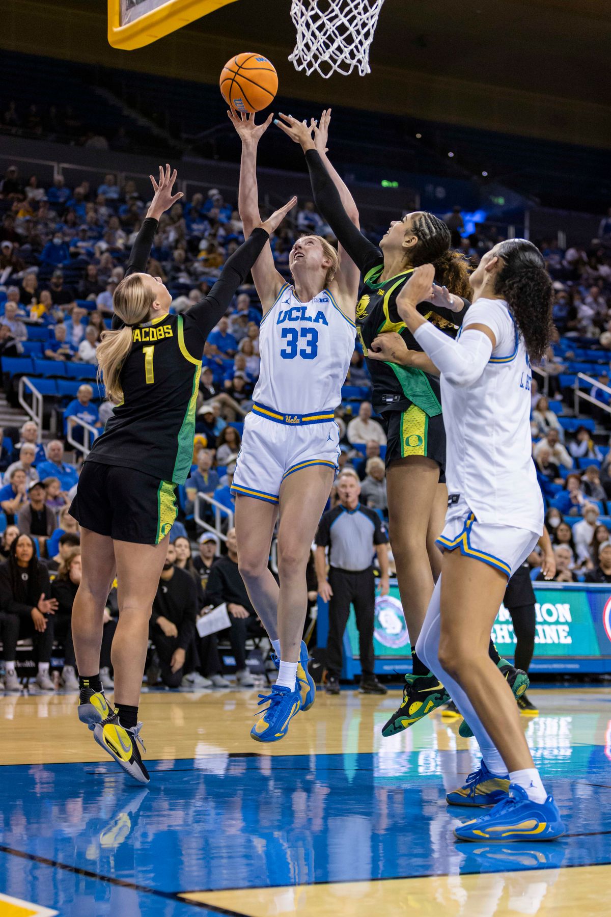 Forward Amanda Muse #33 of the UCLA Bruins lays the ball up during an NCAA basketball game against the Oregon Ducks, Sunday December 7, 2025 in Los Angeles, Calif.