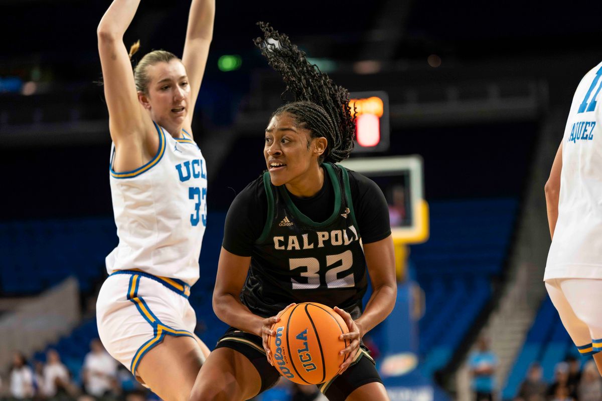 Cal Poly forward, Charish Thompson (32) looking for teammates during a NCAA basketball game against UCLA on December 16, 2025 in Los Angeles, CA.