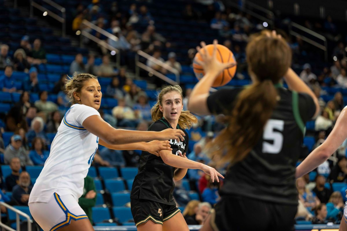 Cal Poly forward, Nora Perez (9) passes during a NCAA basketball game against UCLA on December 16, 2025 in Los Angeles, CA.