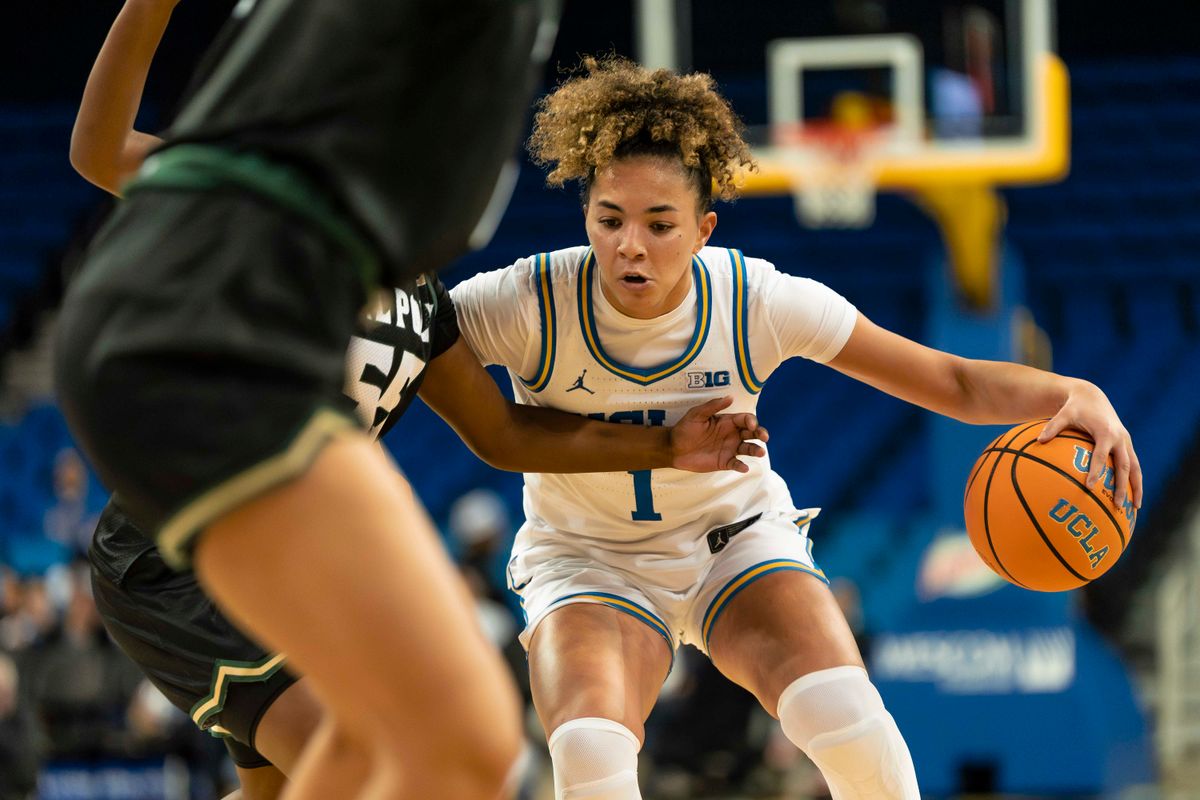 UCLA guard, Kiki Rice (1) dribbling during a NCAA basketball game against Cal Poly on December 16, 2025 in Los Angeles, CA.