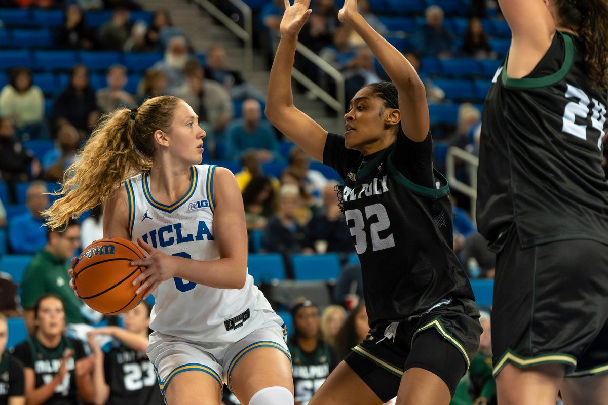 UCLA guard, Gianna Kneepkens (8) looks for teammates to pass to during a NCAA basketball game against Cal Poly on December 16, 2025 in Los Angeles, CA.