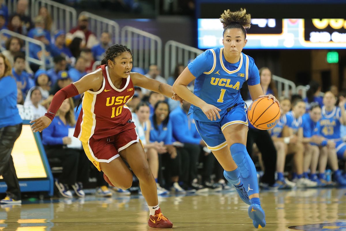 UCLA guard Kiki Rice (1) dribbles the basketball during an NCAA basketball game against USC on January 3, 2026 in Los Angeles, CA.