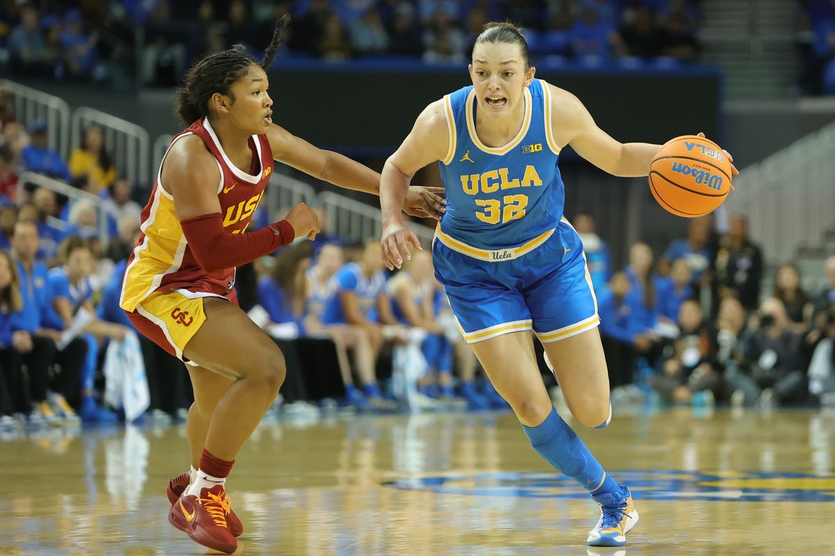 UCLA forward Angels Dugalic (32) dribbles the basketball during an NCAA basketball game against USC on January 3, 2026 in Los Angeles, CA.