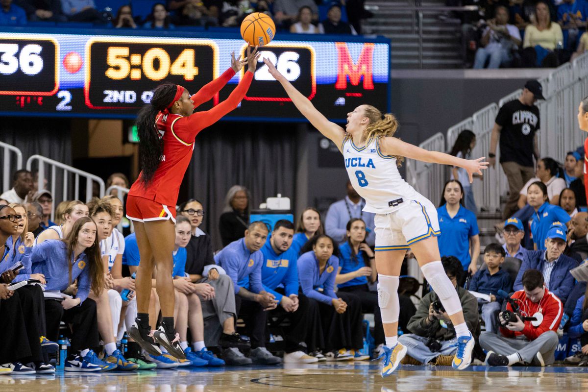 Oluchi Okananwa #7 of the Maryland Terrapins shoots the ball over Gianna Kneepkens #8 of the UCLA Bruins during an NCAA basketball game, Sunday January 18, 2026 in Los Angeles, Calif. 