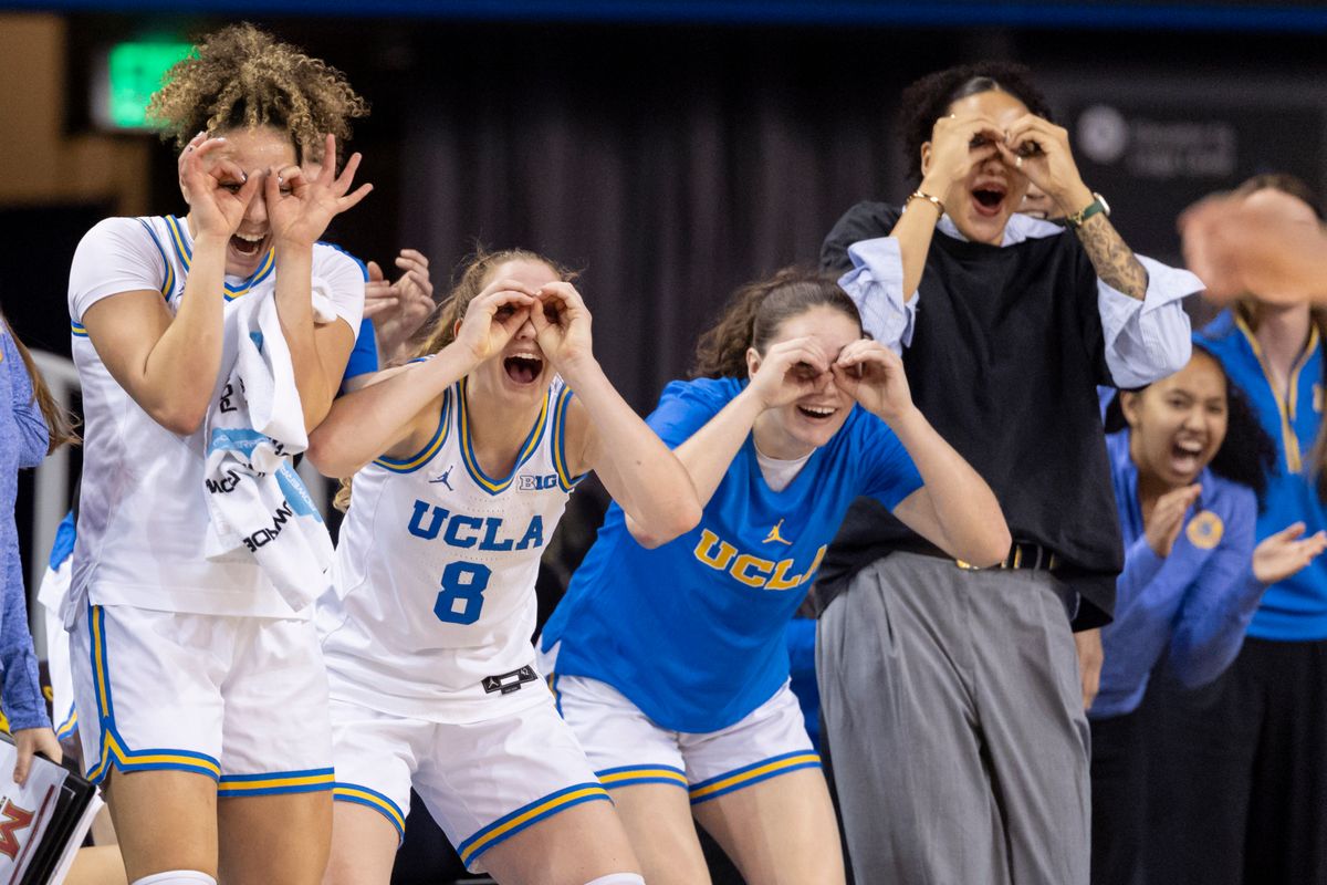 Kiki Rice #1, Gianna Kneepkens #8, and the UCLA Bruins bench celebrate on the sidelines during an NCAA basketball game against the Maryland Terrapins, Sunday January 18, 2026 in Los Angeles, Calif.