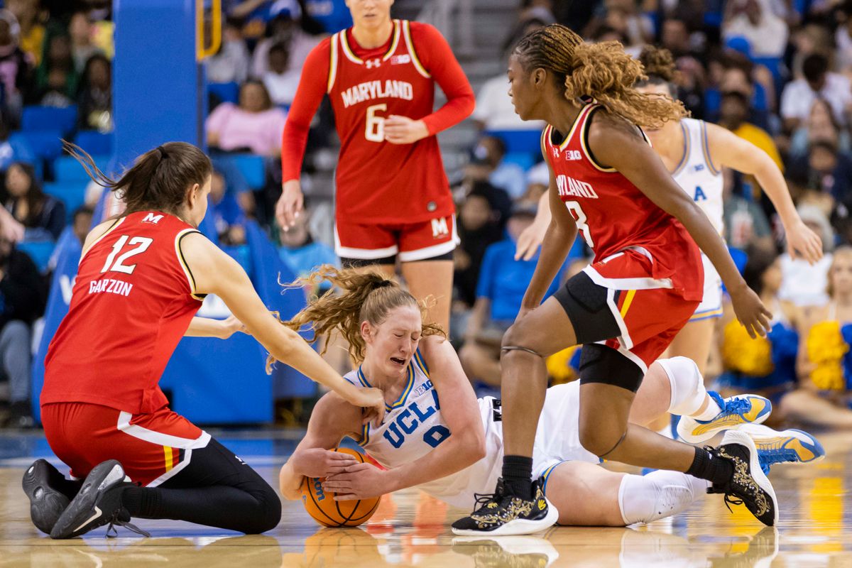 Gianna Kneepkens #8 of the UCLA Bruins dives for a loose ball during an NCAA basketball game against the Maryland Terrapins, Sunday January 18, 2026 in Los Angeles, Calif.