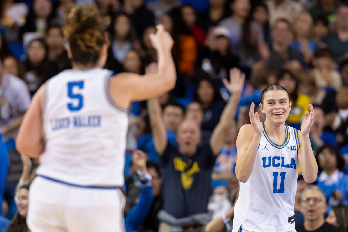 Gabriela Jaquez #11 and Charlisse Leger-Walker #5 of the UCLA Bruins celebrate after a play during an NCAA basketball game against the Maryland Terrapins, Sunday January 18, 2026 in Los Angeles, Calif.