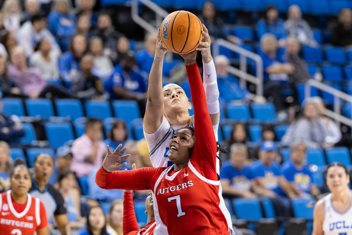 Precious Gem Wheeler #7 of the Rutgers Scarlet Knights and Lauren Betts #51 of the UCLA Bruins reach for the ball during an NCAA basketball game, Wednesday February 4, 2026 in Los Angeles, Calif.