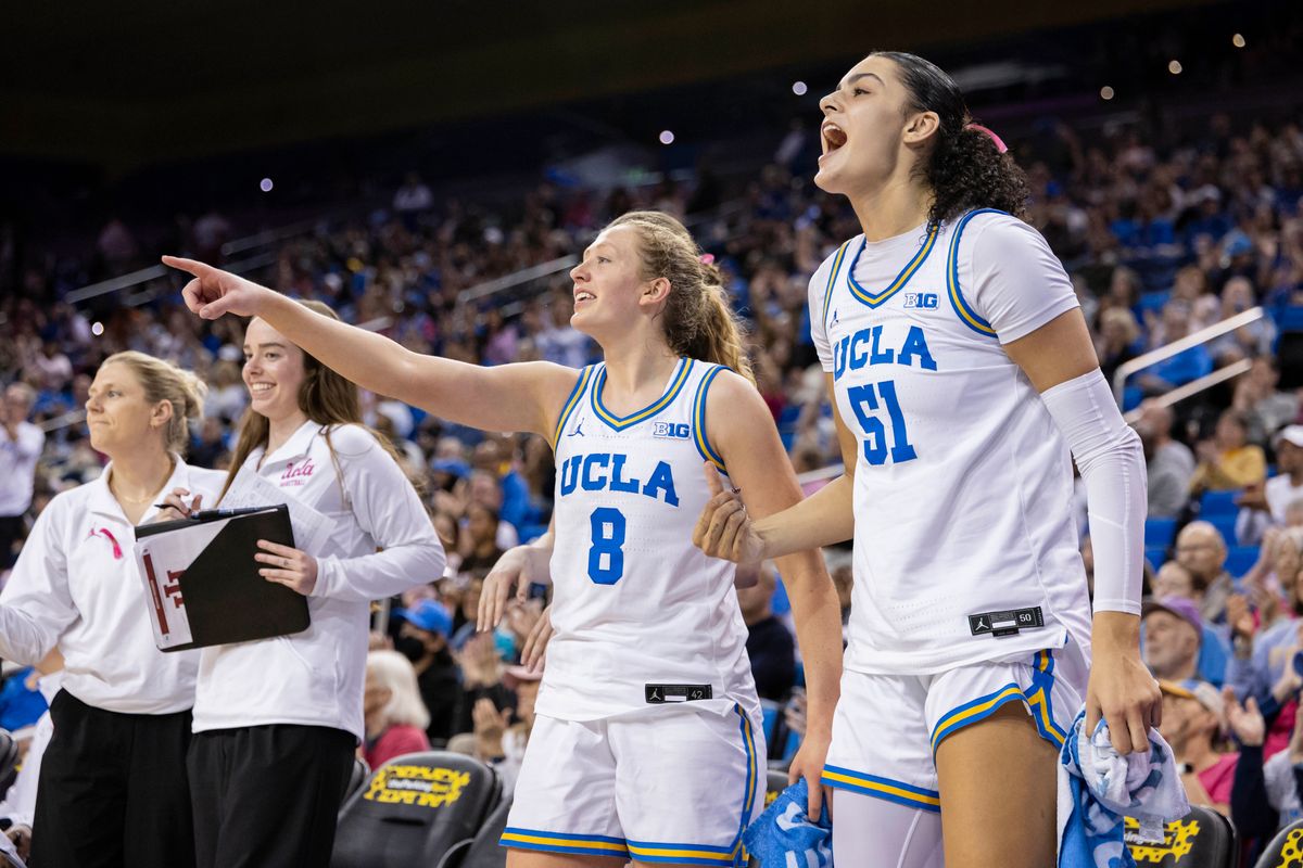 Gianna Kneepkens #8 and Lauren Betts #51 of the UCLA Bruins celebrate on the bench during an NCAA basketball game against the Indiana Hoosiers, Sunday February 15, 2026 in Los Angeles, Calif.