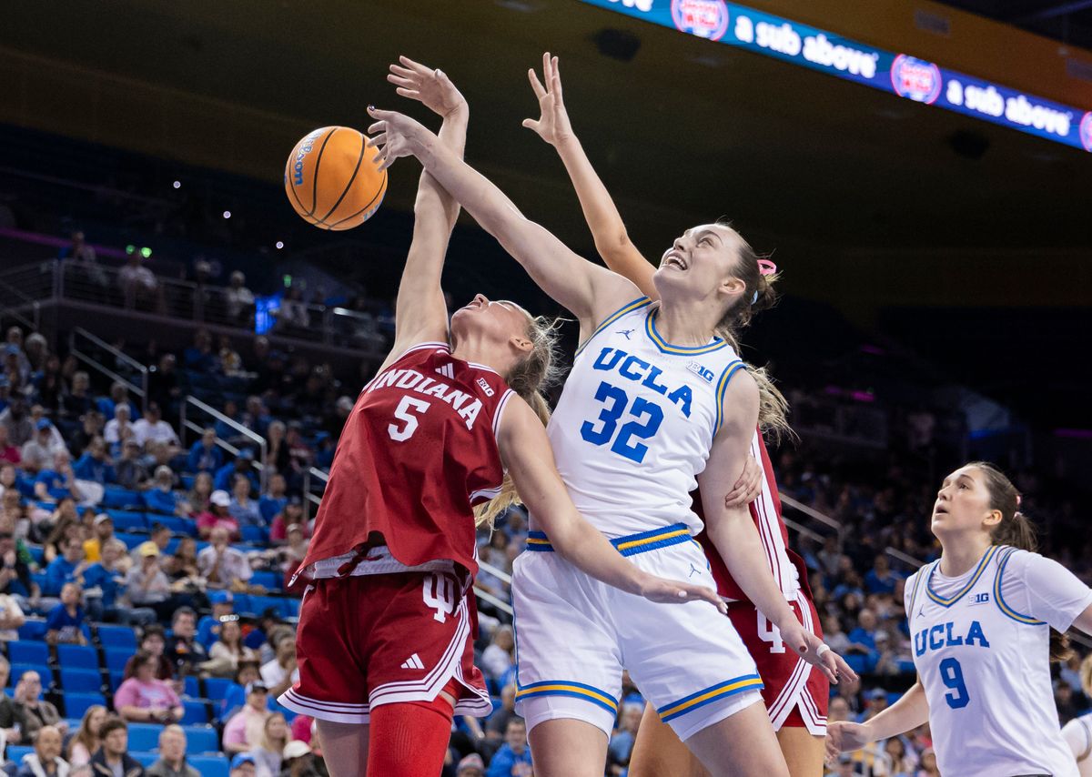 Angela Dugalić #32 of the UCLA Bruins and Lenée Beaumont #5 of the Indiana Hoosiers battle for a rebound during an NCAA basketball game, February 15, 2026 in Los Angeles, Calif.