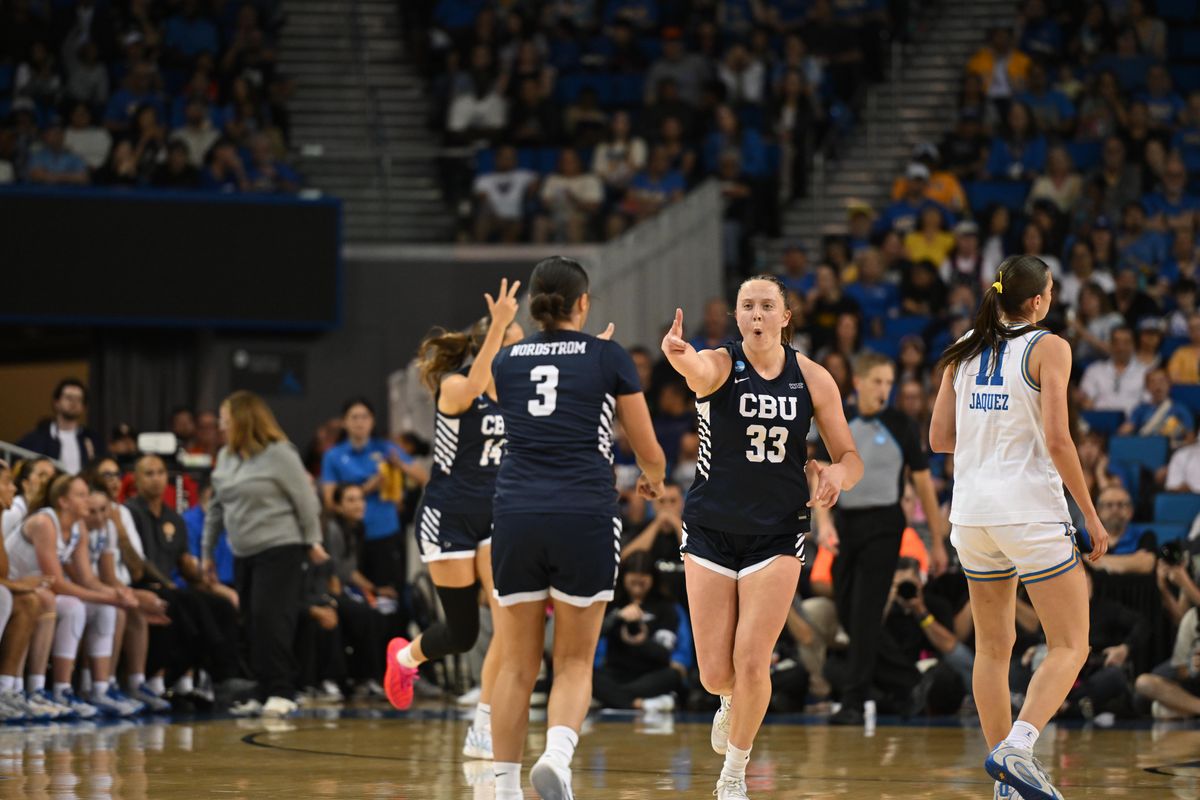 CBU forward Amanda Muse #33 celebrates after team mate Shawnessy Nordstrom #3 made a three point shot during an NCAA Women's Basketball game between California Baptist University and University of California Los Angeles on Saturday, March 21, 2026 at Pauley Pavilion in Los Angeles Calif
