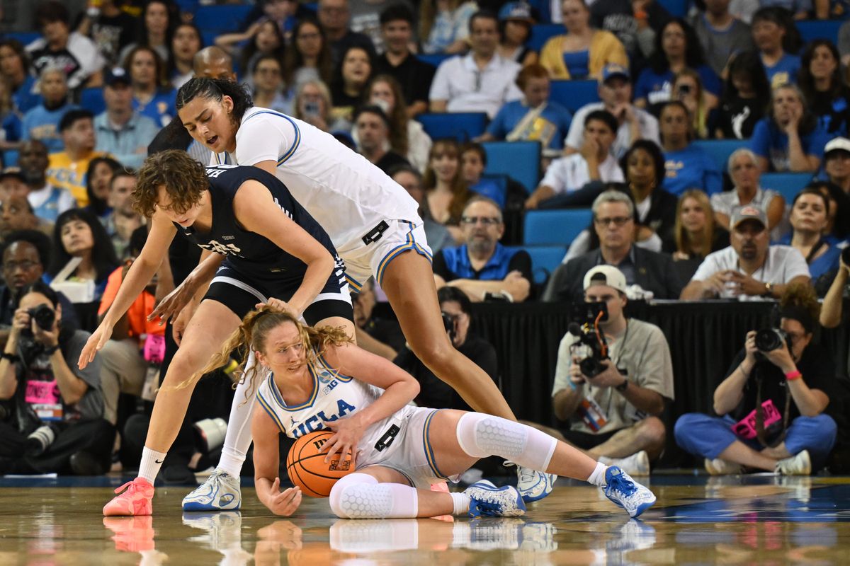 UCLA guard Gianna Kneepkens #8 dives for the loose ball during an NCAA Women's Basketball game between California Baptist University and University of California Los Angeles on Saturday, March 21, 2026 at Pauley Pavilion in Los Angeles Calif