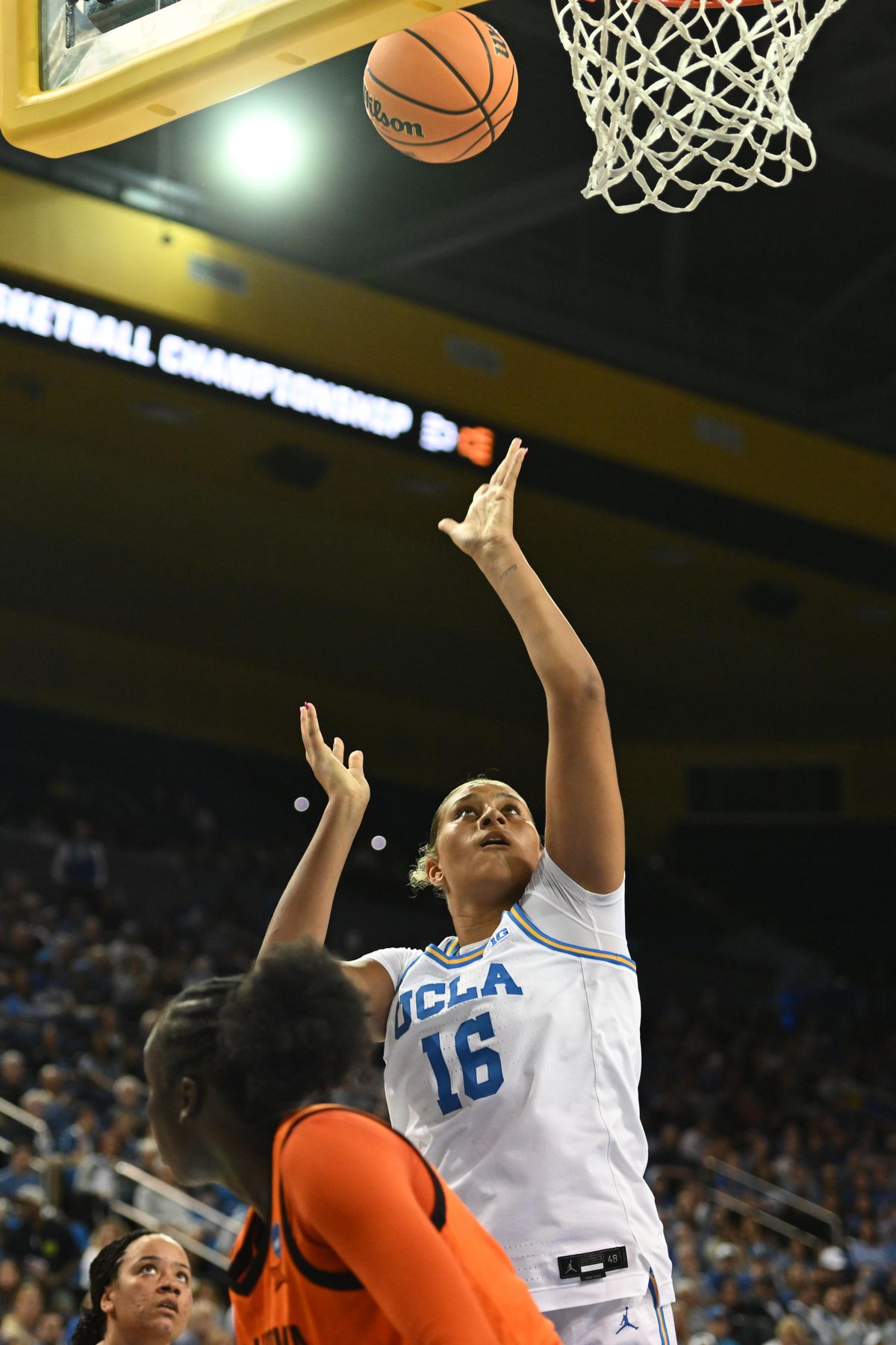 UCLA forward Sienna Betts #16 makes a move under the basket during an NCAA Women's Basketball game between Oklahoma State University and University of California Los Angeles on Monday, March 23, 2026 at Pauley Pavilion in Los Angeles Calif