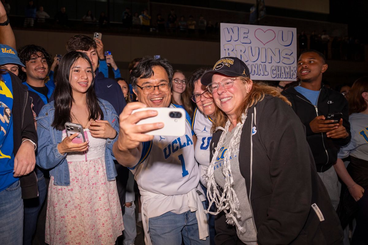 UCLA head coach Cori Close takes photos with fans after winning the NCAA women's basketball National Championship on April 5th, 2026 at UCLA Campus in Los Angeles, CA. UCLA head coach Cori Close takes photos with fans after winning the NCAA women's basketball National Championship on April 5th, 2026 at UCLA Campus in Los Angeles, CA.