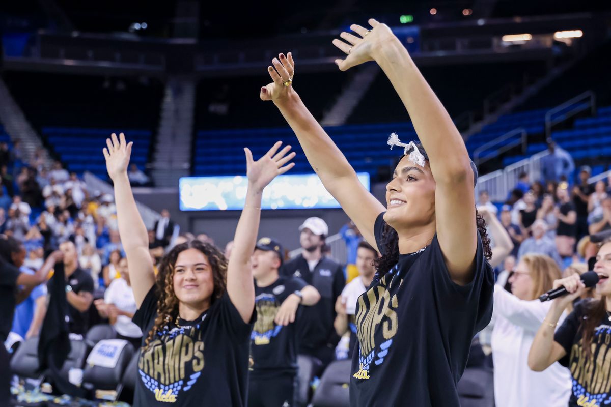Lauren Betts and Charlisse Leger-Walker wave to the crowd during the celebration for the NCAA Champion UCLA Bruins Women’s basketball team, Wednesday April 8, 2026, in Los Angeles, Calif.
