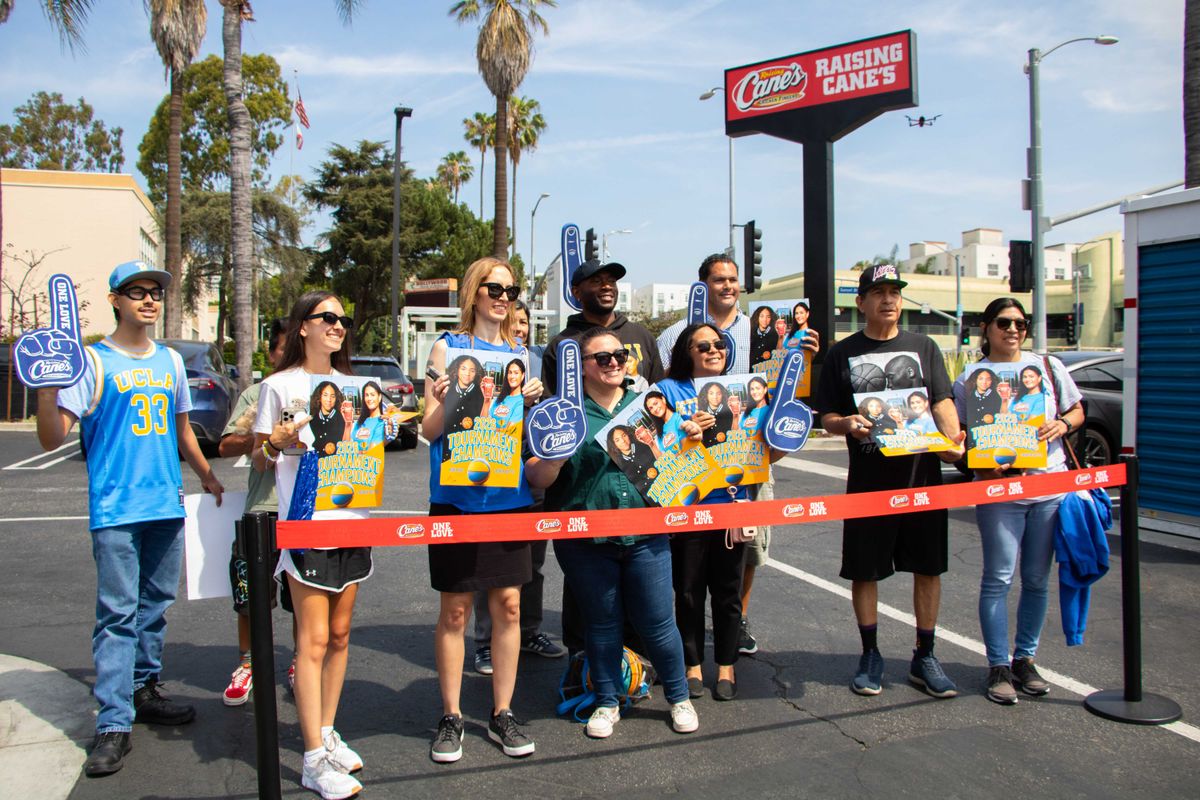 UCLA fans gather outside of Raising Cane's in Hollywood, CA. 