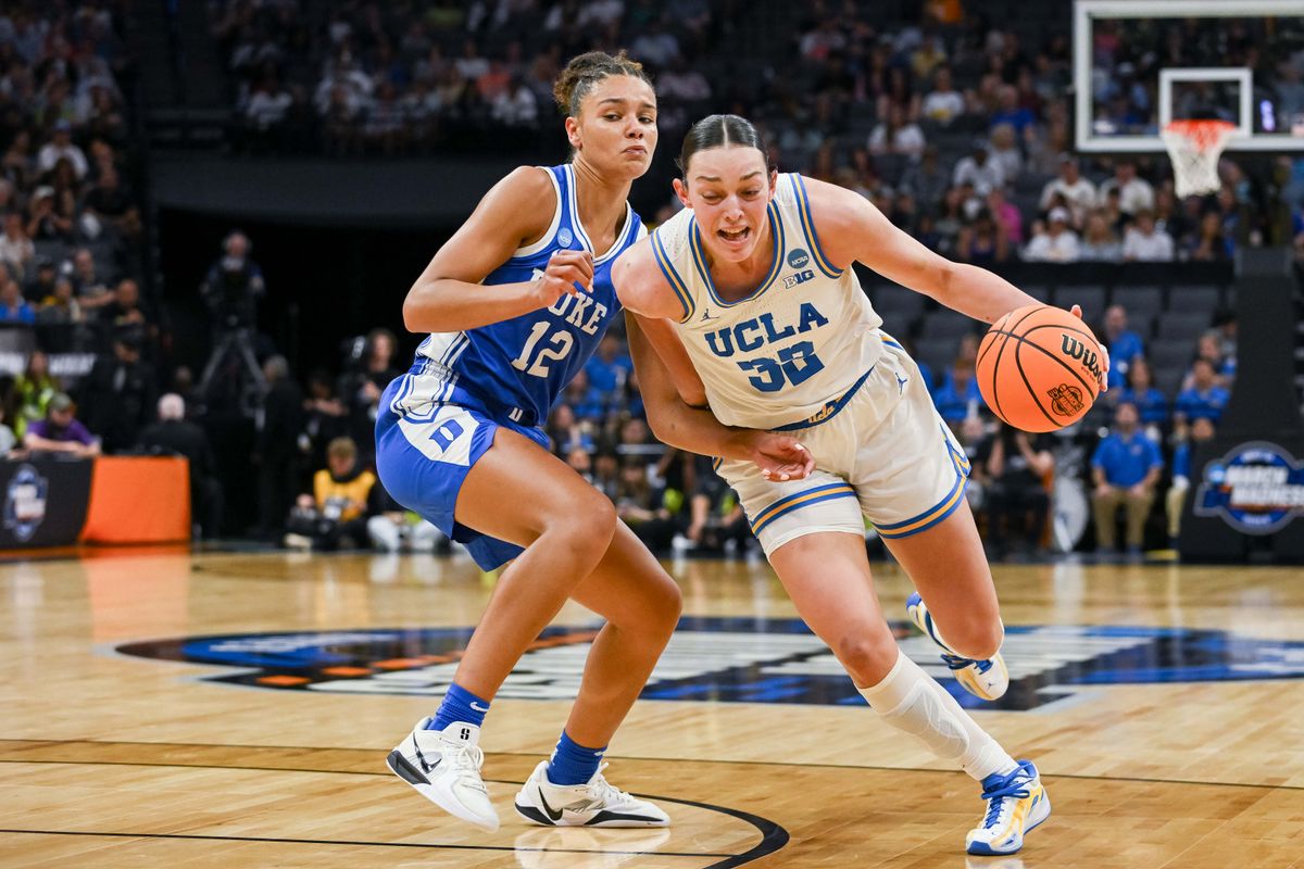 UCLA Bruins forward Angela Dugalić (32) drives to the basket against Duke Blue Devils forward Delaney Thomas (12) during the second quarter in the Sacramento Regional 4 of the women's 2026 NCAA Tournament at the Golden 1 Center. 