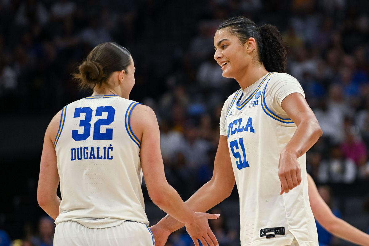 UCLA Bruins forward Angela Dugalić (32) and center Lauren Betts (51) celebrate after defeating the Duke Blue Devils in an Elite Eight game in the Sacramento Regional 4 of the women's 2026 NCAA Tournament at the Golden 1 Center.