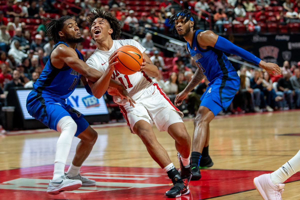 UNLV guard Dedan Thomas Jr. (11) drives through the paint during college basketball game against Memphis on Saturday November 9, 2024 in Las Vegas.  