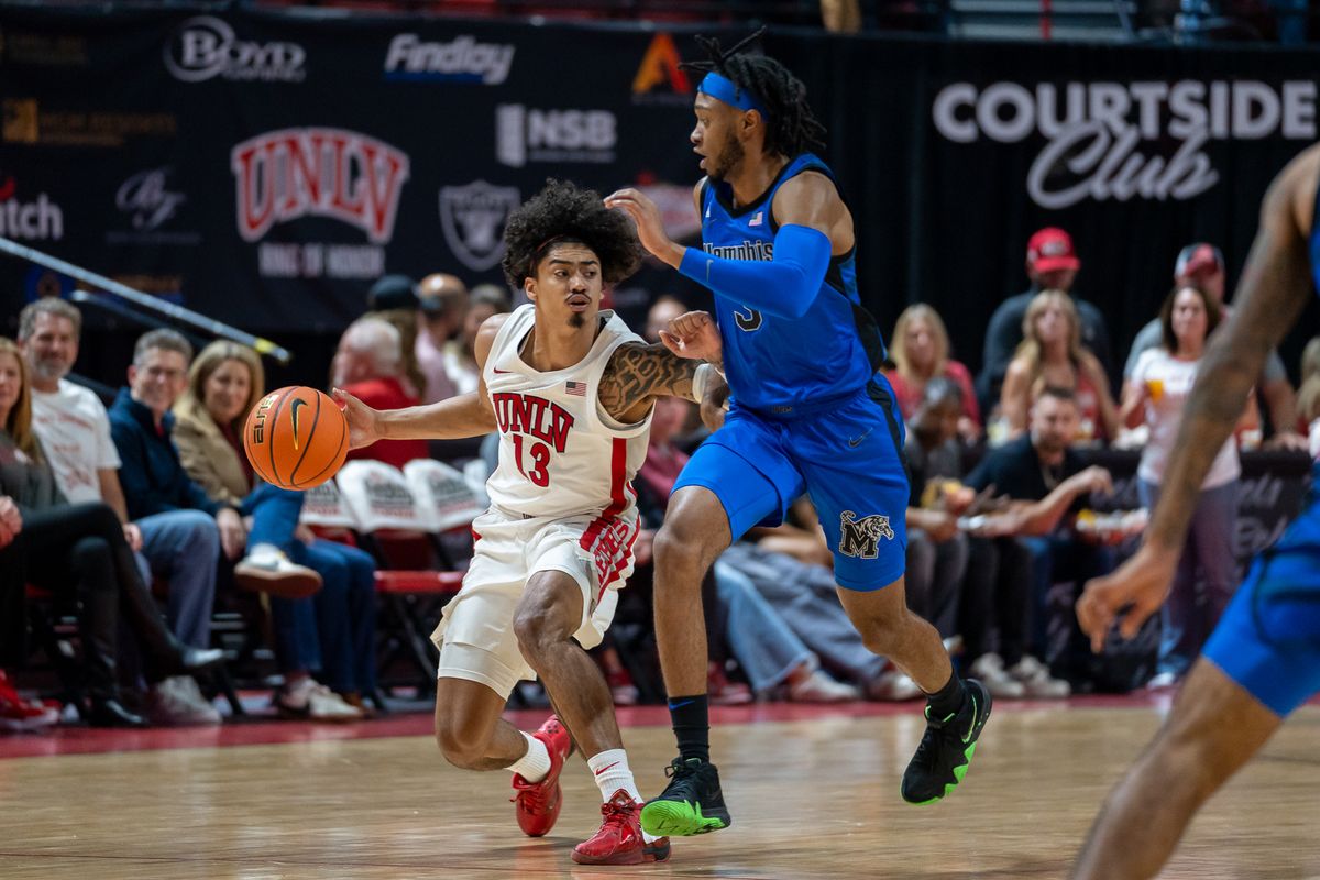 UNLV guard Brooklyn Hicks (13) scans the court while maintaining posesion of the ball during college basketball game against Memphis on Saturday November 9, 2024 in Las Vegas.  