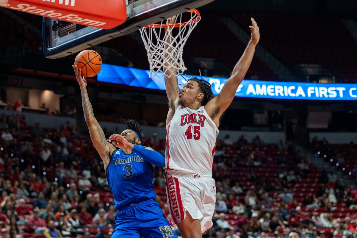 UNLV Jeremiah Cherry (45) blocks a shot from Memphis’s Colby Rogers (3) during college basketball game against Memphis on Saturday November 9, 2024 in Las Vegas.