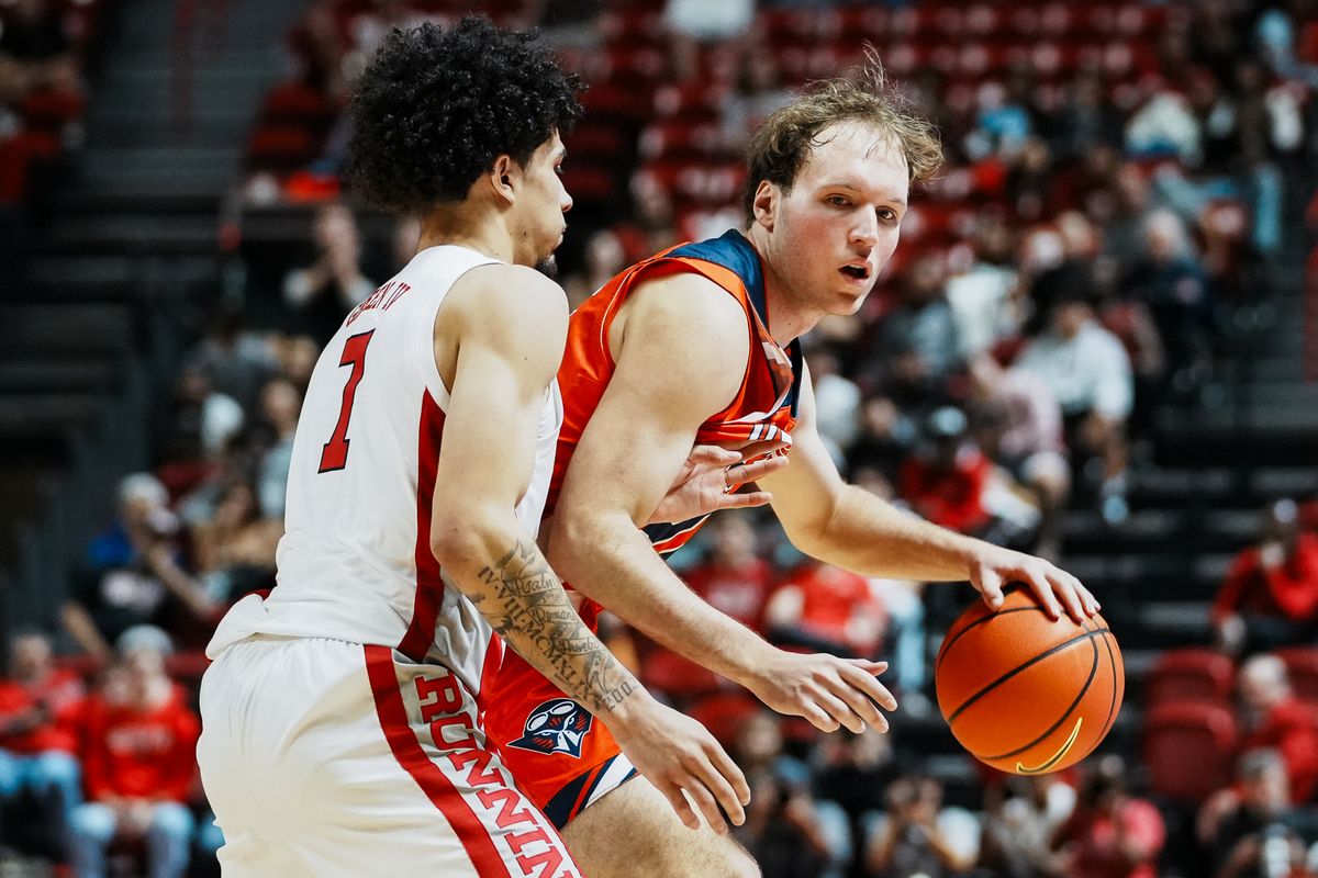 UT Martin guard Fillip Radaković (33) scans the court while guarded by UNLV guard Al Green (7) during second half of college basketball game against UNLV on Tuesday Nov. 4, 2025 at Thomas and Mack Center in Las Vegas.