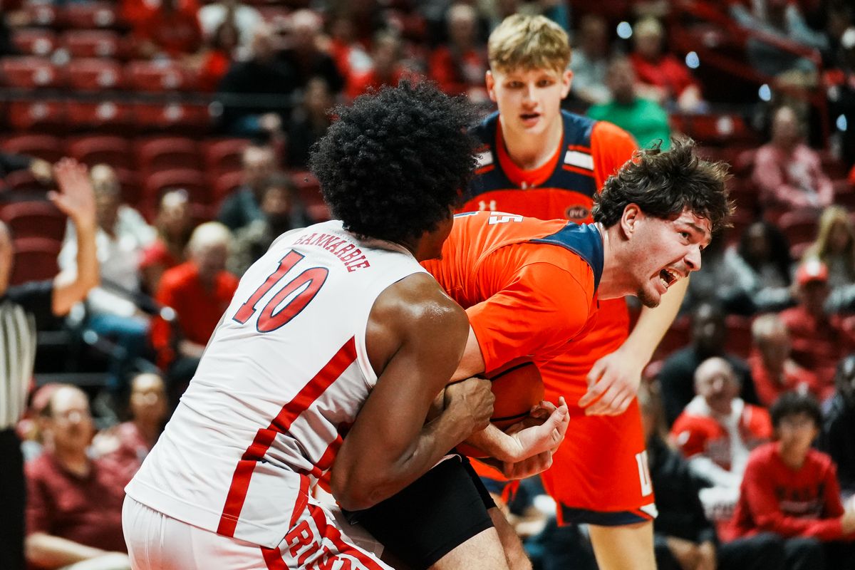 UT Martin Pedro Santos (9) and UNLV forward Jacob Bannarbie (10) battle for possession of the ball  during second half of college basketball game against UNLV on Tuesday Nov. 4, 2025 at Thomas and Mack Center in Las Vegas.