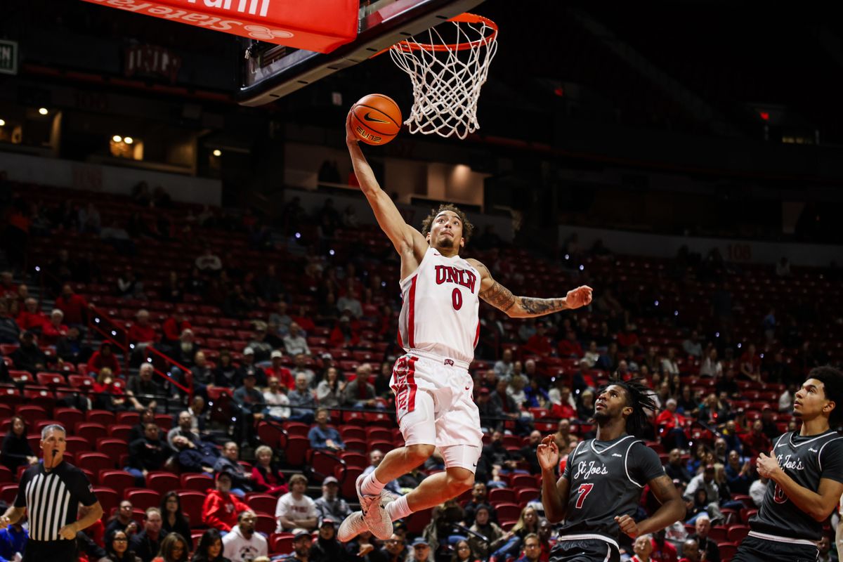 UNLV Runnin' Rebels G Dravyn Gibbs-Lawhorn (0) dunks the ball during an NCAA basketball game against the Saint Joseph's Hawks on Thursday November 20, 2025, in Las Vegas, Nevada. 